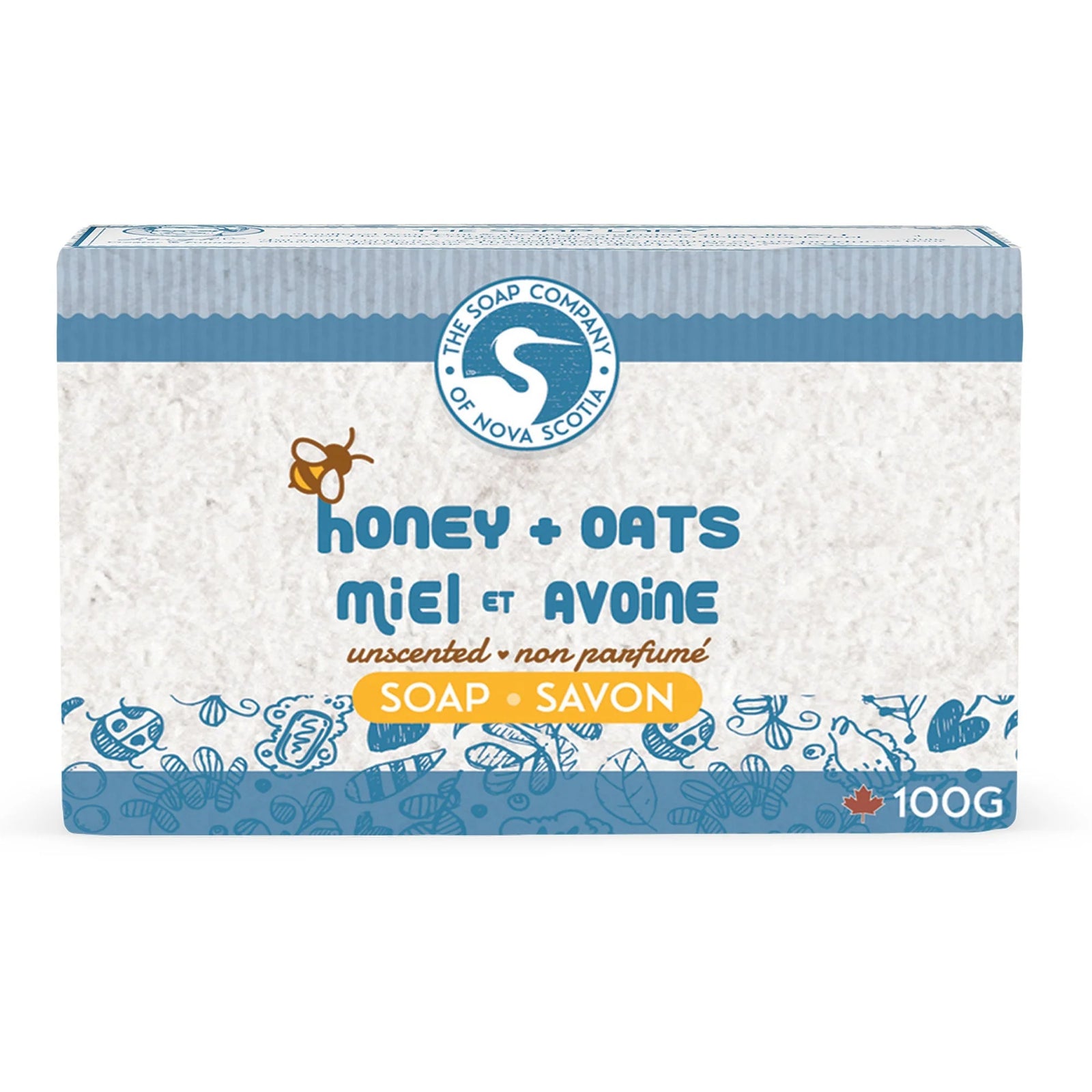 Two bars of soap with oatmeal and honey on a wooden surface