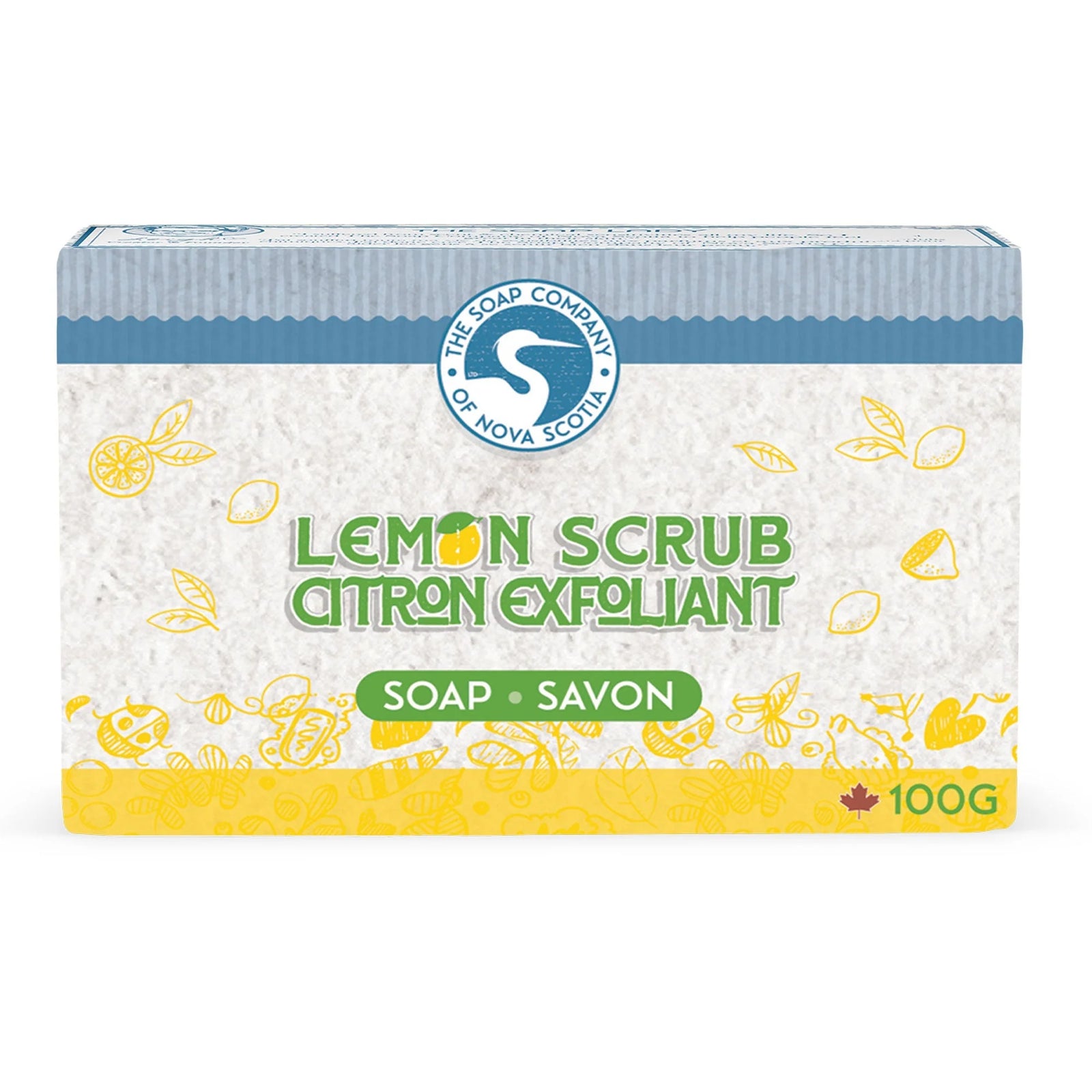 Two bars of lemon soap on a marble slab with lemons and a bowl of salt in the background.